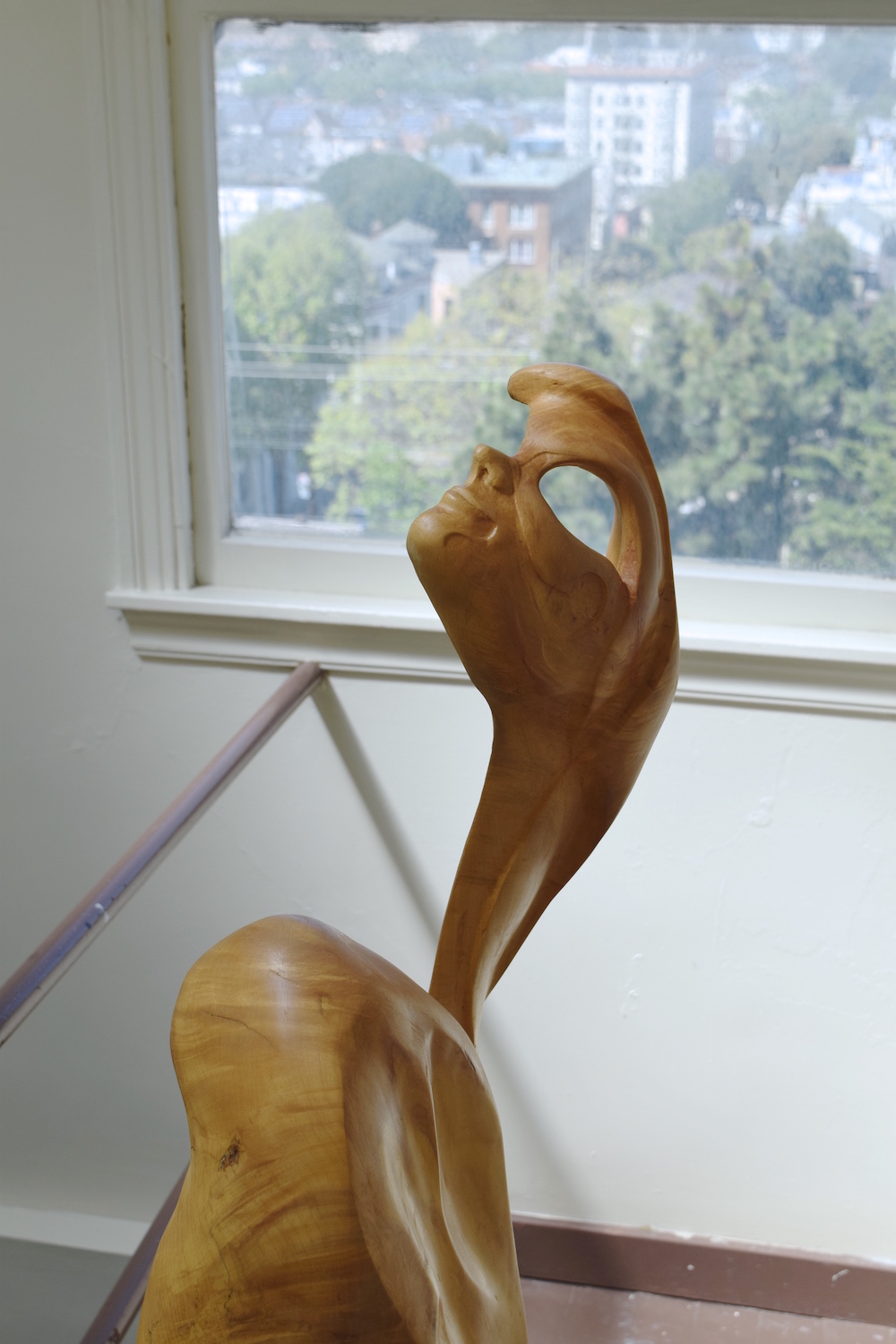 detail of head of large wooden sculpture of abstract female form by unknown artist